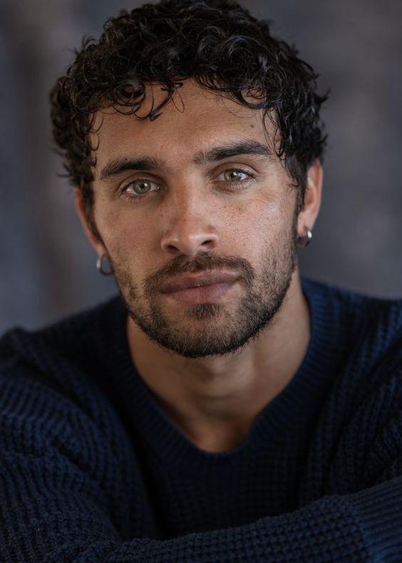 Man with natural curls and undercut