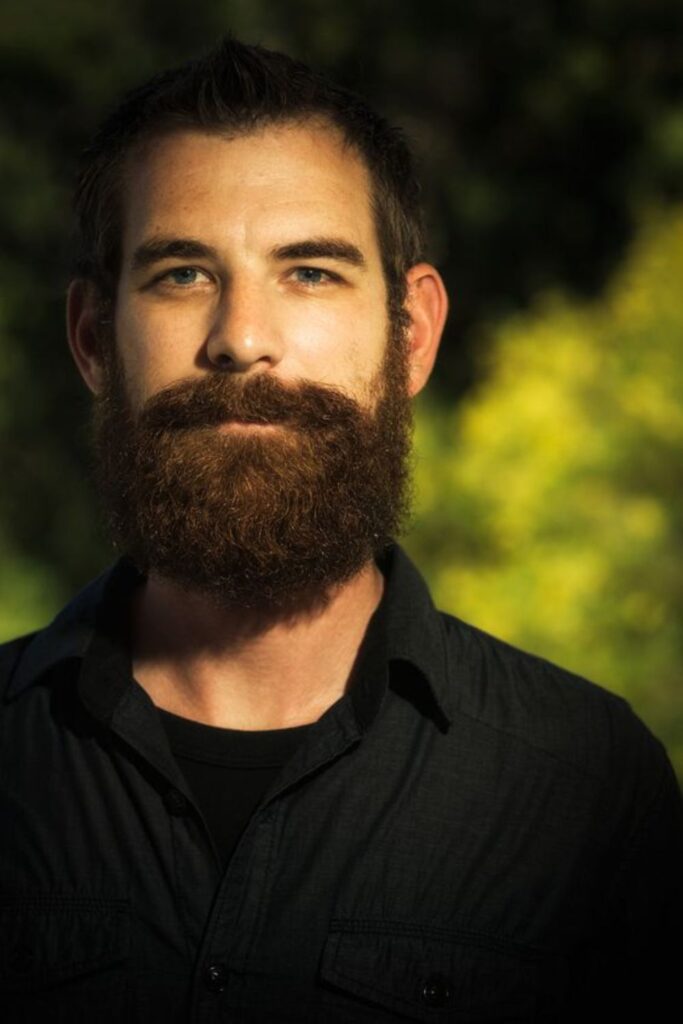 Lumberjack Beard with Extended Sideburns and Textured Layers