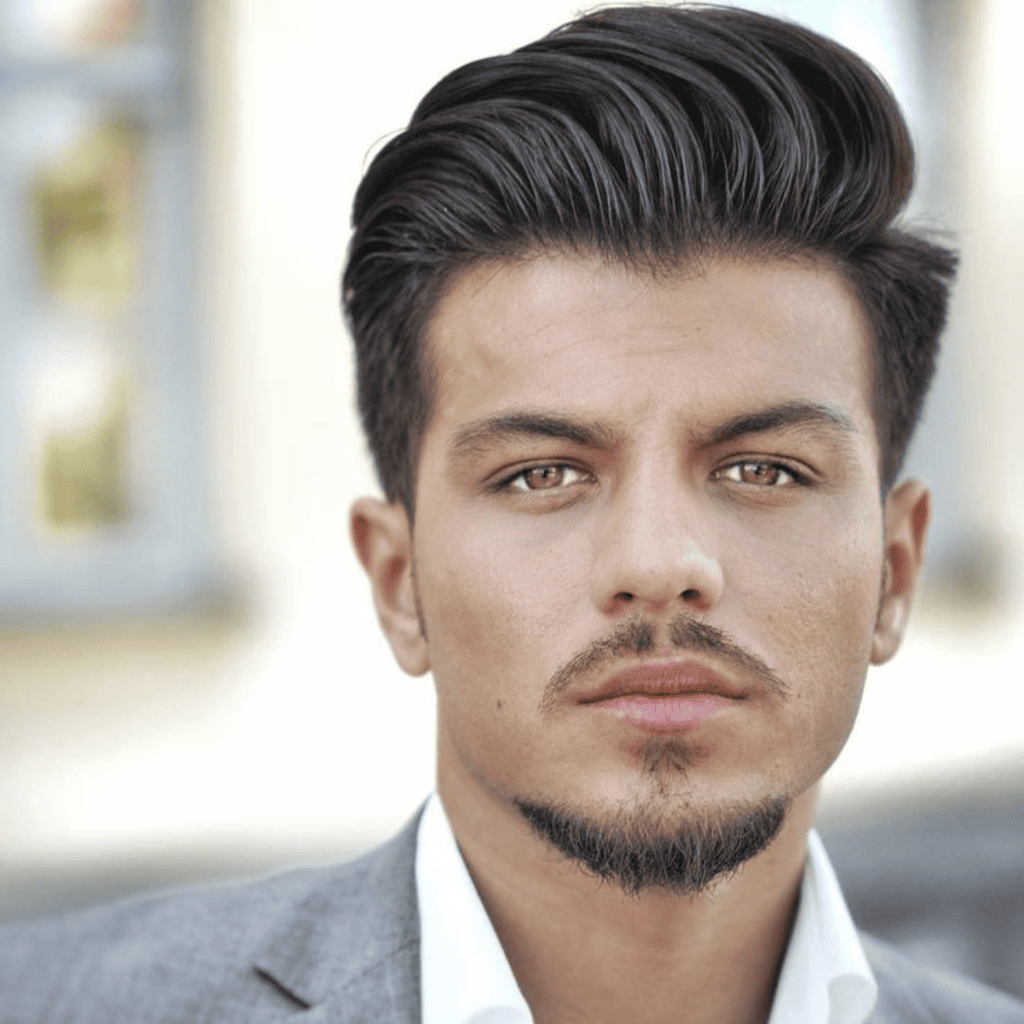 Portrait of a man with buzz cut and a dapper goatee