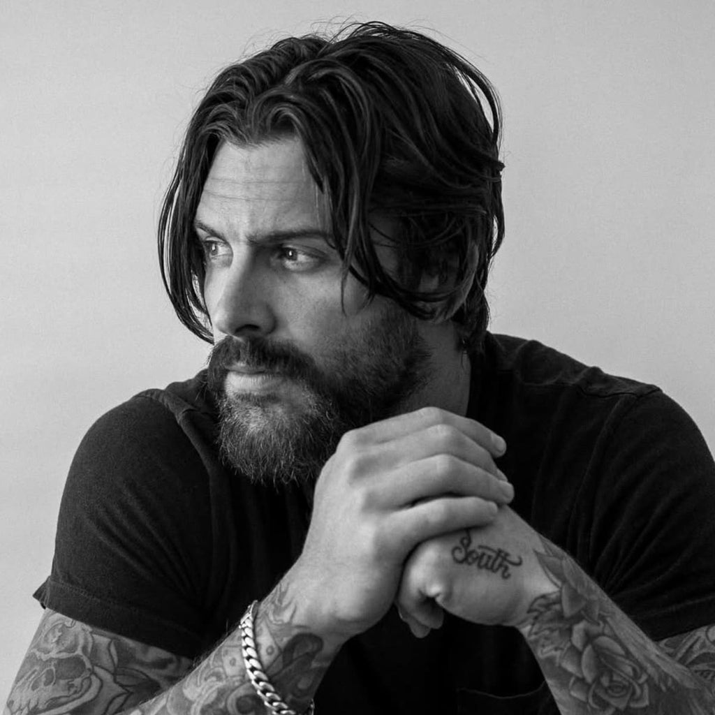 Portrait of a Man with Stylish Hair and a Short Shaggy Beard