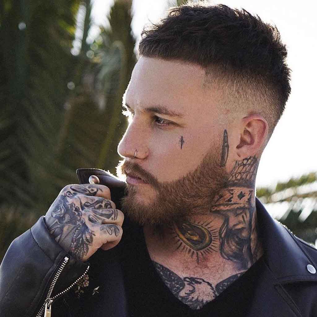 Man with slick pompadour and low skin fade