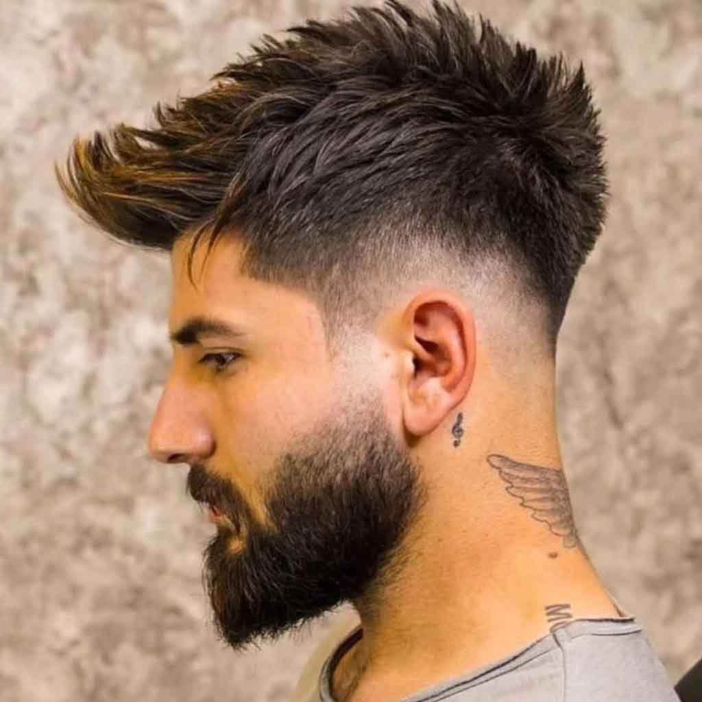 Man with textured waves and high skin fade